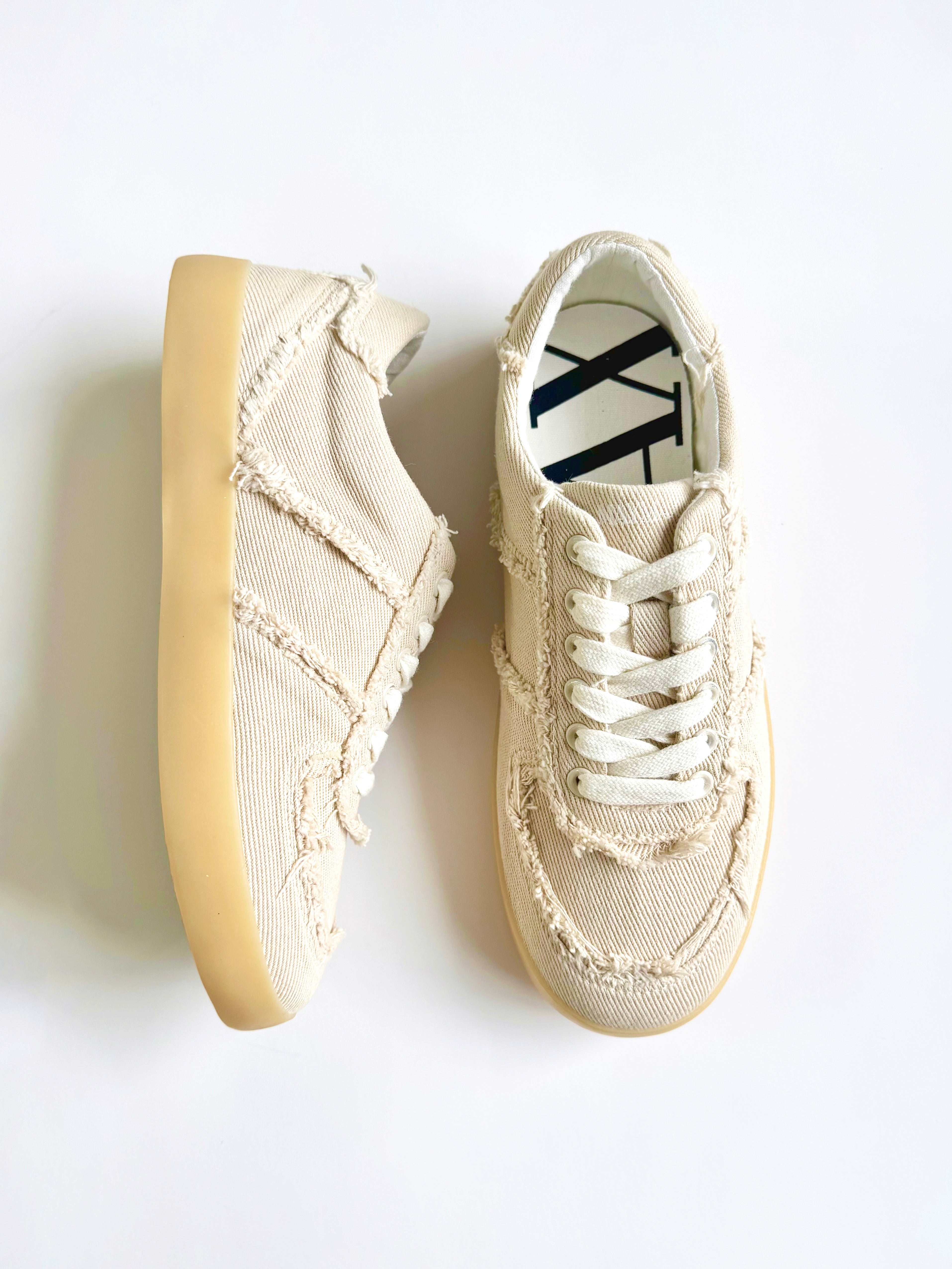 Side view of MayMax Frayed Edge Canvas Sneaker with gum rubber sole