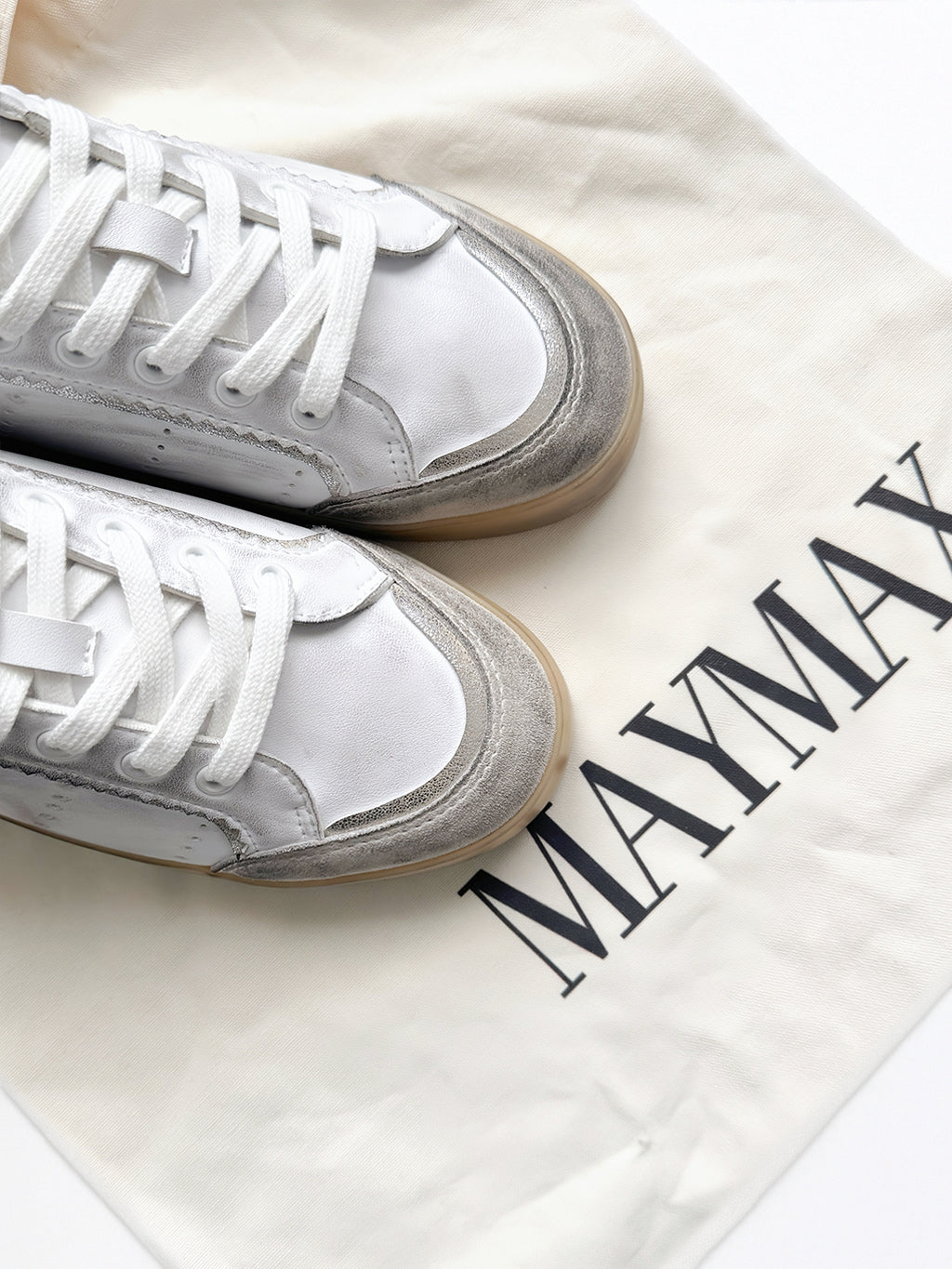 Close-up of MayMax Distressed White Sneaker vintage distressed detailing