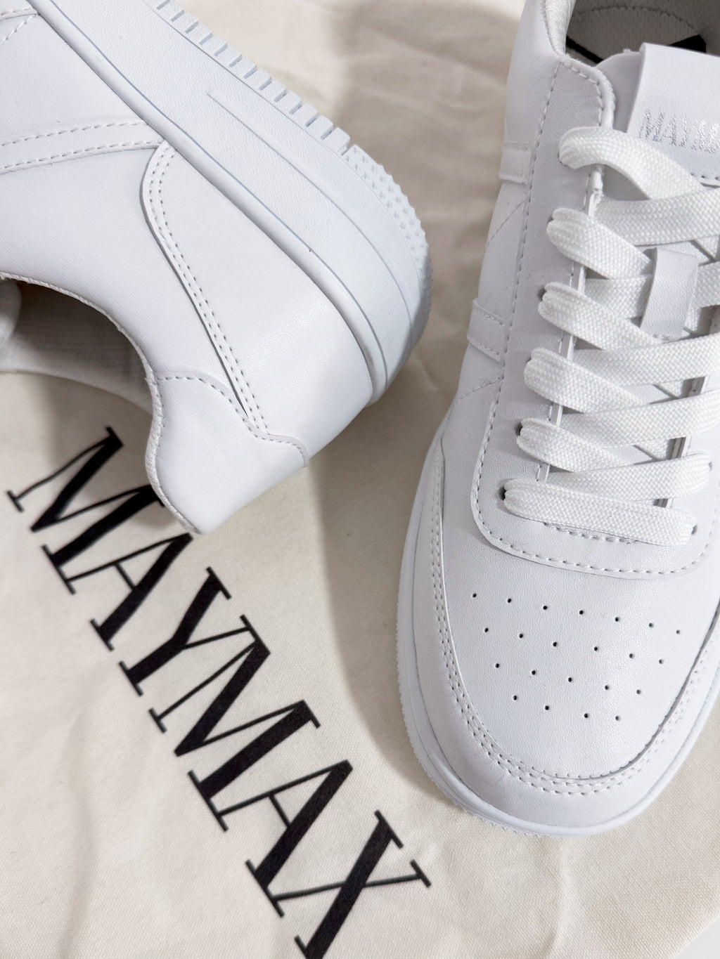 Close-up of MayMax Essential White Sneaker lace-up detail